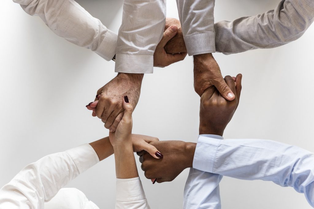 International Students Holding Hands Image