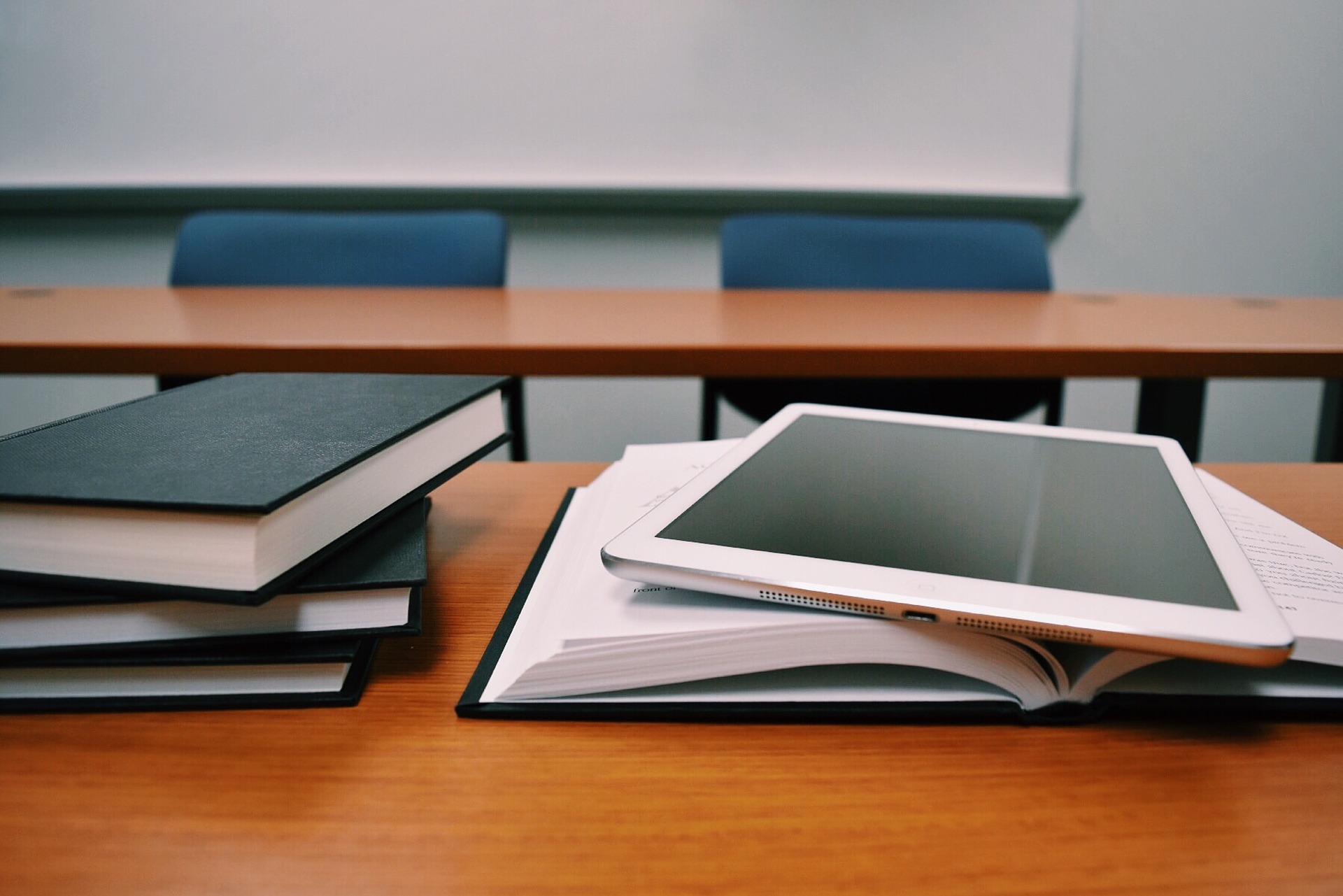 Tablet Over Books Image